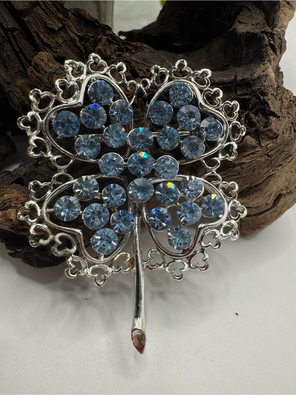 Vintage silver tone and baby blue rhinestone clover brooch, EUC.